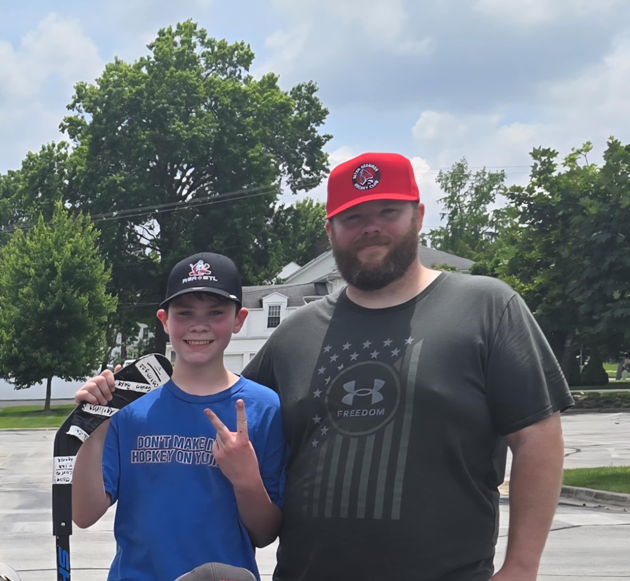 Jaron Davis with his son after roller hockey